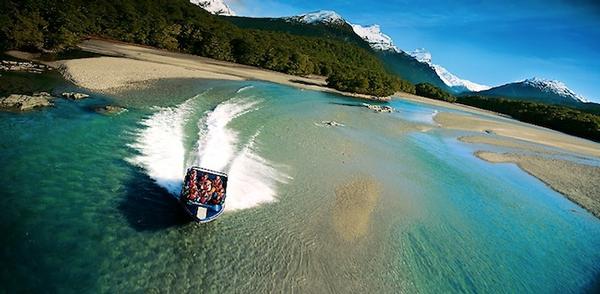 Dart River Jet Safaris guests enjoy stunning scenery and exciting jet boating.